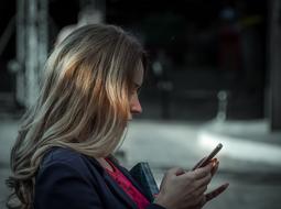 Blonde Girl holding Mobile