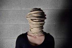 photo of a girl with ropes on her face