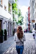 young woman on the paved street