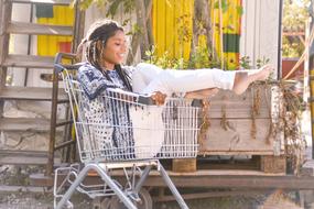 Happy young girl in Shopping cart