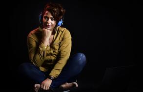 person Music Listening black background