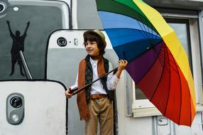 boy with rainbow umbrella