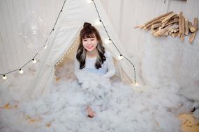 girl in white on a christmas photo shoot