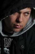 photo portrait of a guy in a jacket with a hood