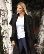blonde posing near trees