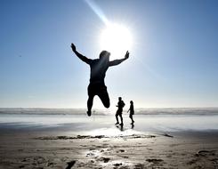 jumping man on the beach