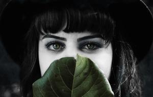 black and white, girl face and green leaf