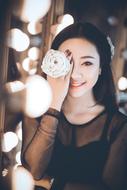 Beautiful Young Woman in the holiday lights