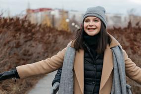 happy young girl in winter clothing outdoor