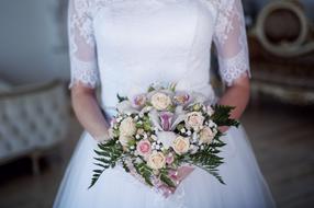 Bridal bouquet in female hands