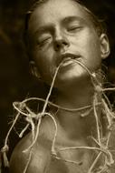 Retro portrait of a young woman, with wire in the mouth
