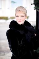 beautiful blonde in black fur coat