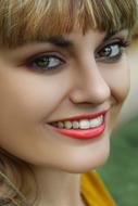 photo of a girl with a snow-white smile