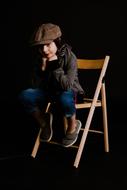 Clothing Advertising Children on a chair in a black studio