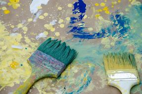two Brushes on grunge painted background
