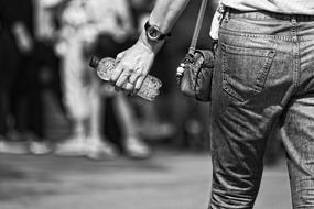 man holding bottle of water