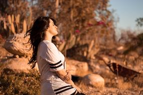 Relaxed young woman at Sunset