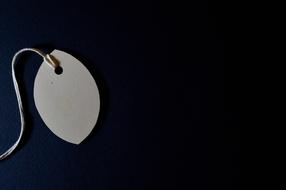 clothing tag on the black background