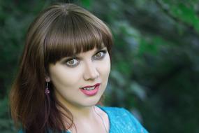 girl with green eyes on a blurred background