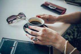 stylish woman with a cup of black coffee