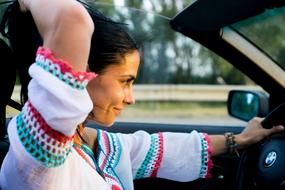 portrait of happy Woman Ride in Bmw car