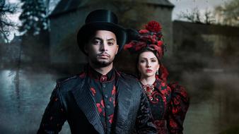 glamour young couple in vintage clothing at dusk
