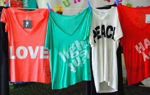 T-shirts of different colors with inscriptions