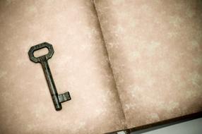 Key on open blank Book