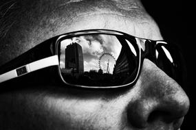 modern city reflected in sunglasses