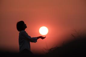 red Sun hand person