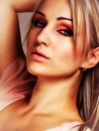 Portrait of the beautiful, shiny woman with colorful make-up, in light