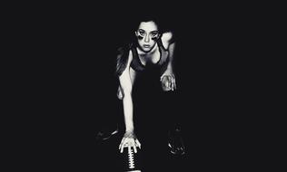 Black and white photo of the beautiful athlete woman, at black background