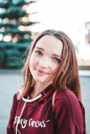 photo of a student in a burgundy sweatshirt