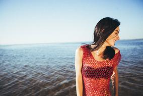 Woman Model red dress blue sea