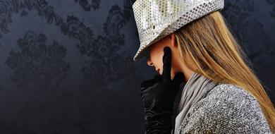 girl in a silver hat posing in profile