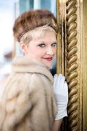 blond woman in fur