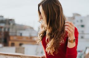 girl in red posing on a blurred background