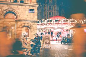 Beautiful landscape of the street with people and colorful lights, at night