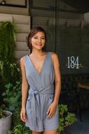 girl with short hair near green plants
