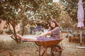 photo of a girl in a garden car