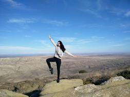 girl stone sky