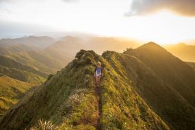 distant view of a girl on a mountain trail