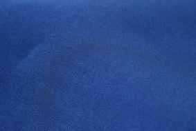 Close-up of the soft, blue textile pattern of the clothing