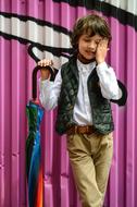 boy advertising clothes with umbrella