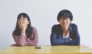 young Asian Man and woman at desk