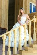 Wedding Bride Dress on wooden stairs