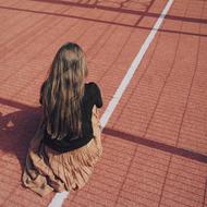 woman sitting on the field