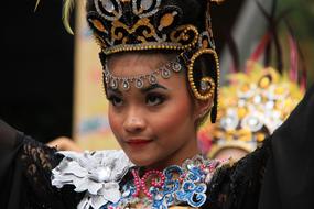 young asian woman in traditional headdress and costume