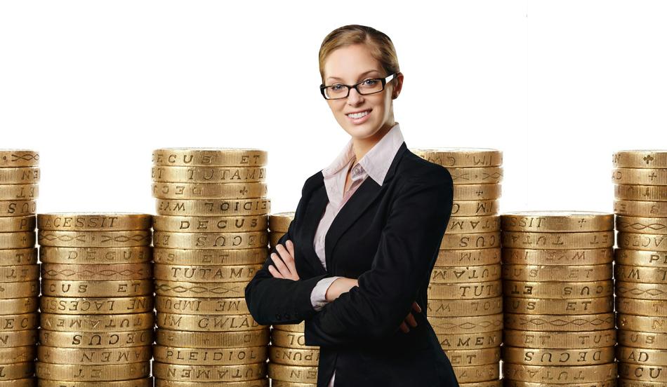 business woman stands against the background of stacks of coins