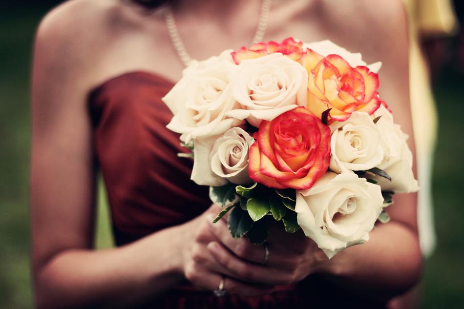 Holding the colorful bouquet of flowers